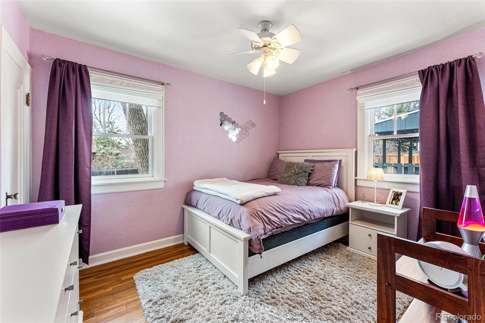 1639 Grape Street Denver, CO 80220 - Photo 18 of 39 a bed room with a bed and a window