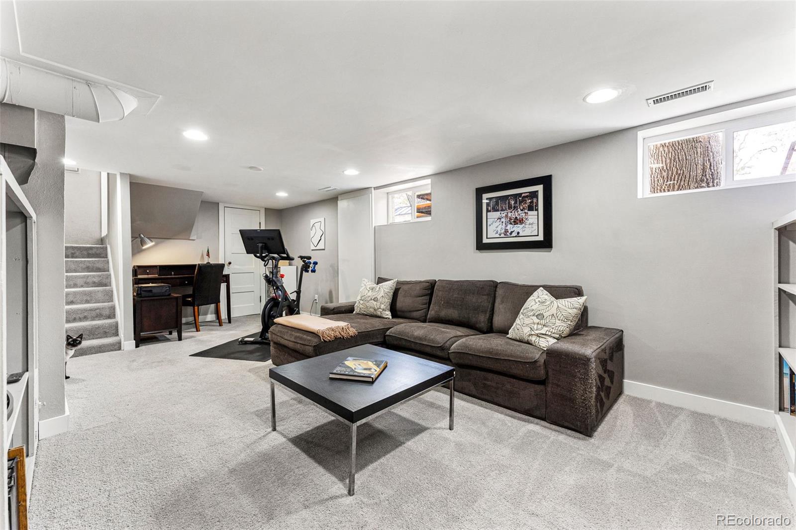 1639 Grape Street Denver, CO 80220 - Photo 23 of 39 a living room with furniture and a gym