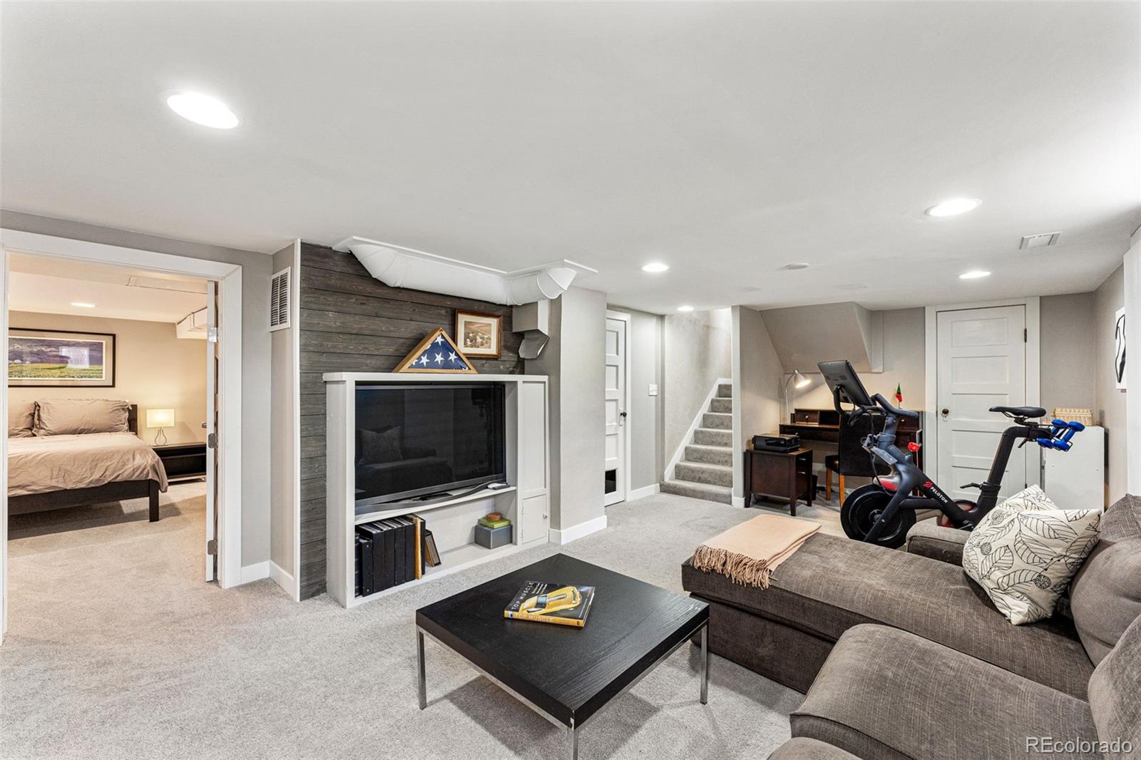 1639 Grape Street Denver, CO 80220 - Photo 24 of 39 a living room with furniture and a flat screen tv