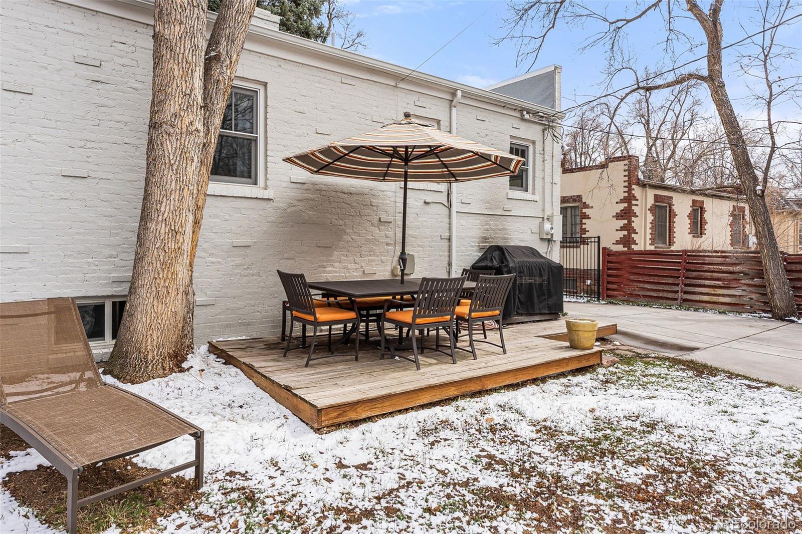 1639 Grape Street Denver, CO 80220 - Photo 30 of 39 a view of a patio with a table and chairs