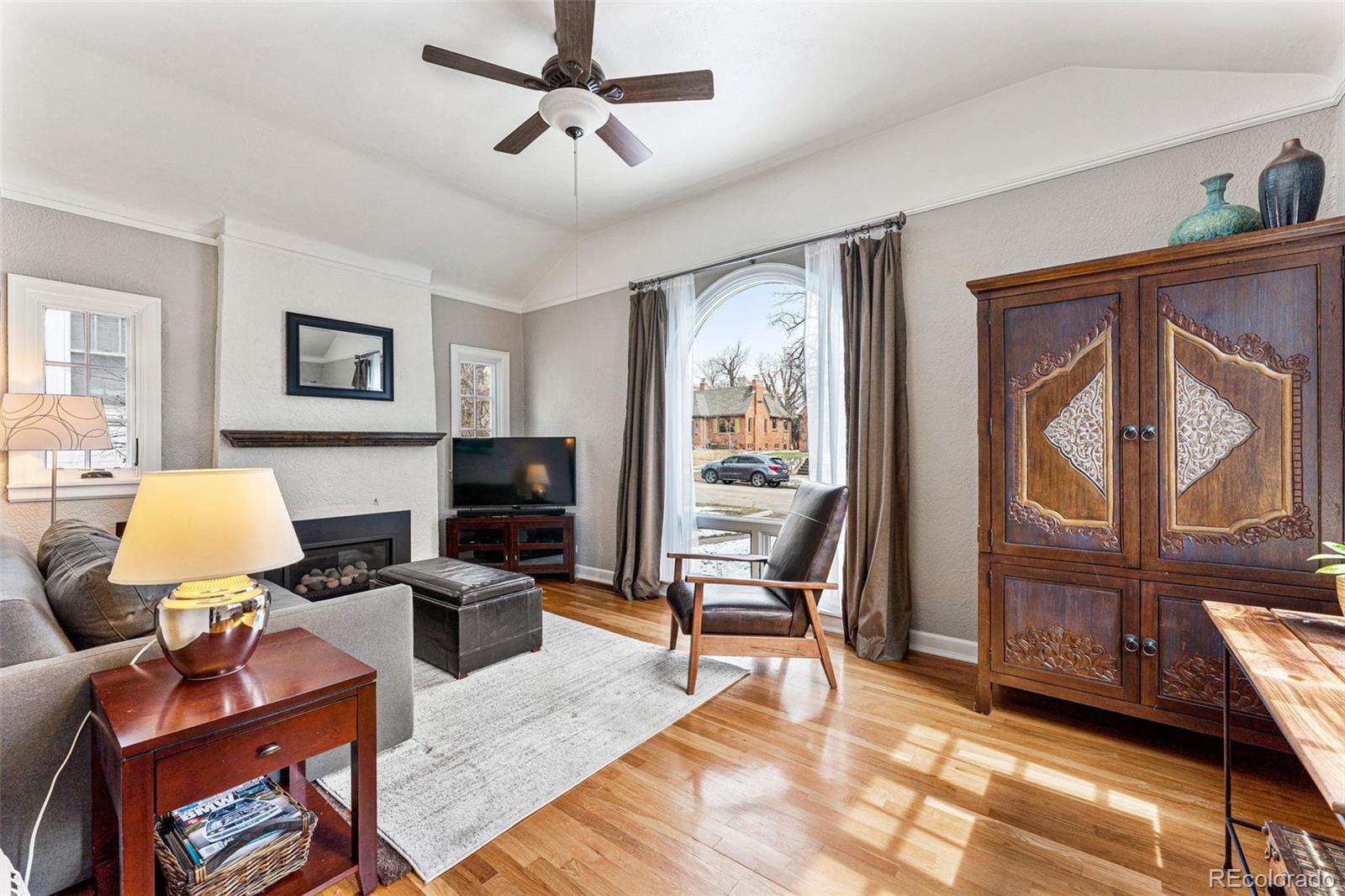 1639 Grape Street Denver, CO 80220 - Photo 3 of 39 a living room with furniture a rug and a window