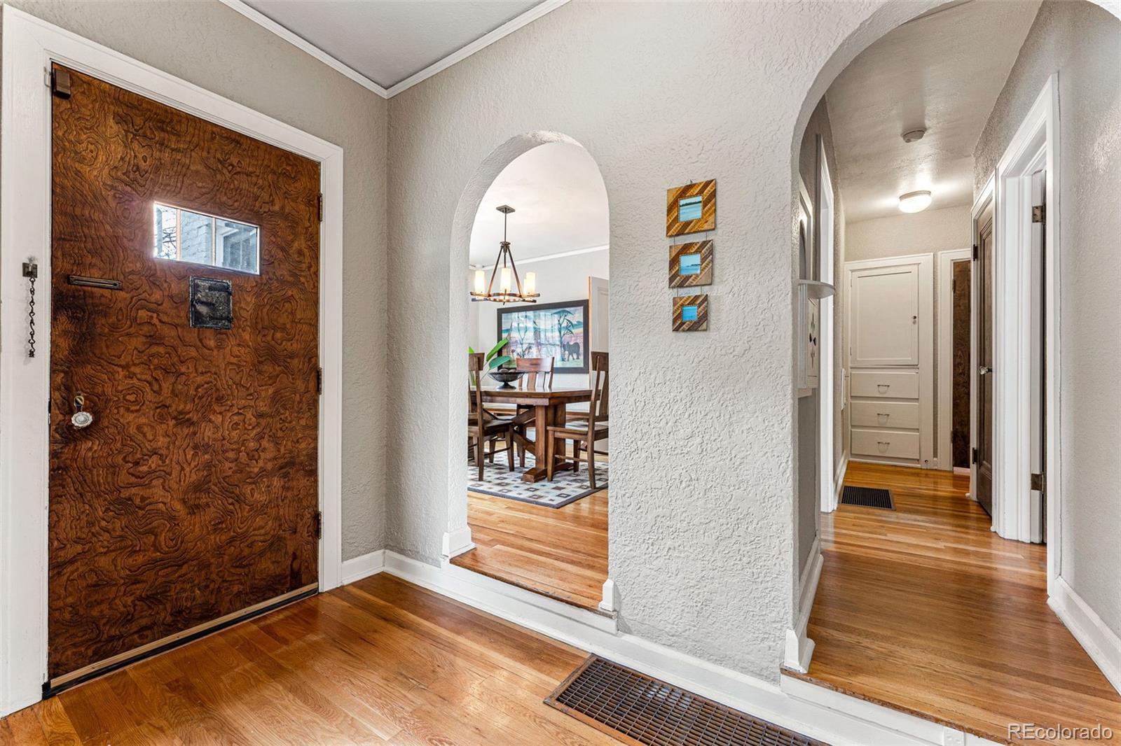 1639 Grape Street Denver, CO 80220 - Photo 8 of 39 a view of livingroom with hardwood floor and hallway