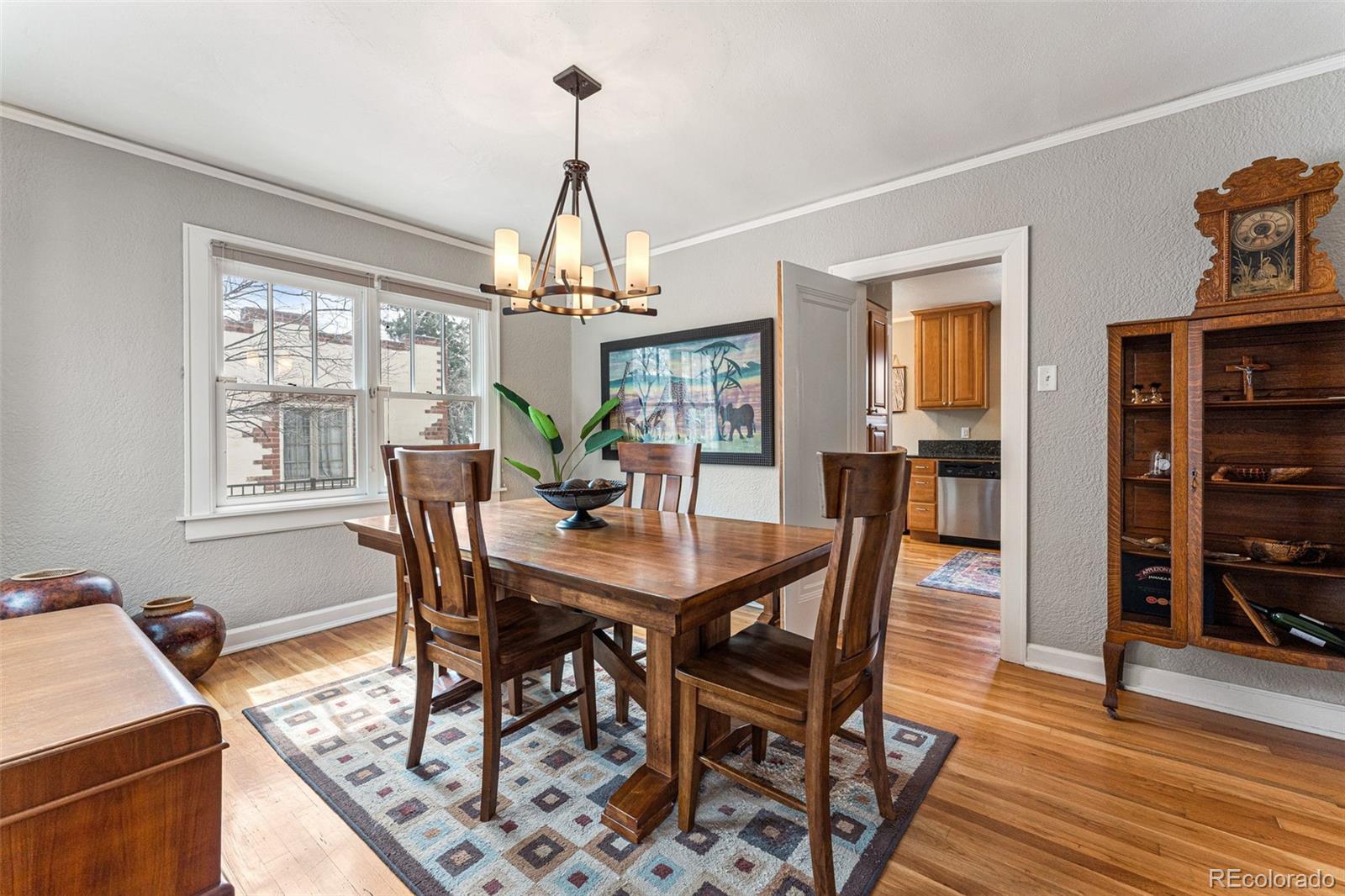 1639 Grape Street Denver, CO 80220 - Photo 9 of 39 a view of a dining room with furniture window and wooden floor