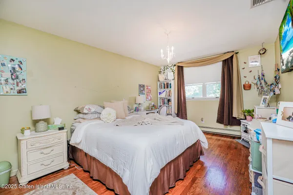 a bed room with a bed and a window