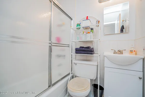 a bathroom with a sink toilet and vanity