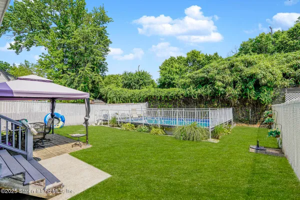an outdoor space with garden view and slide