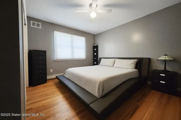 a bedroom with a bed and window