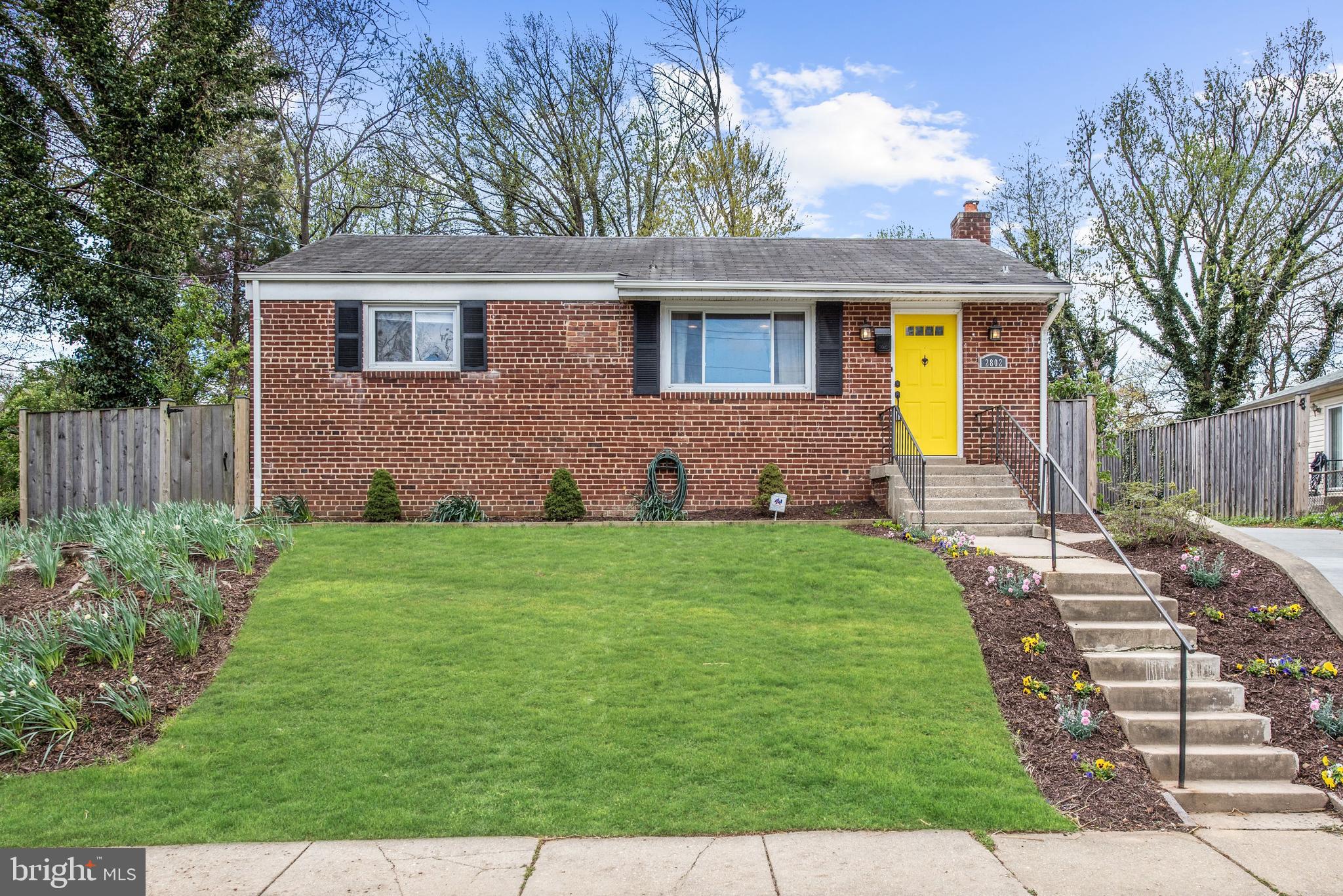 2802 Harris Avenue Silver Spring, MD 20902 - Photo 1 of 43 a front view of a house with a garden