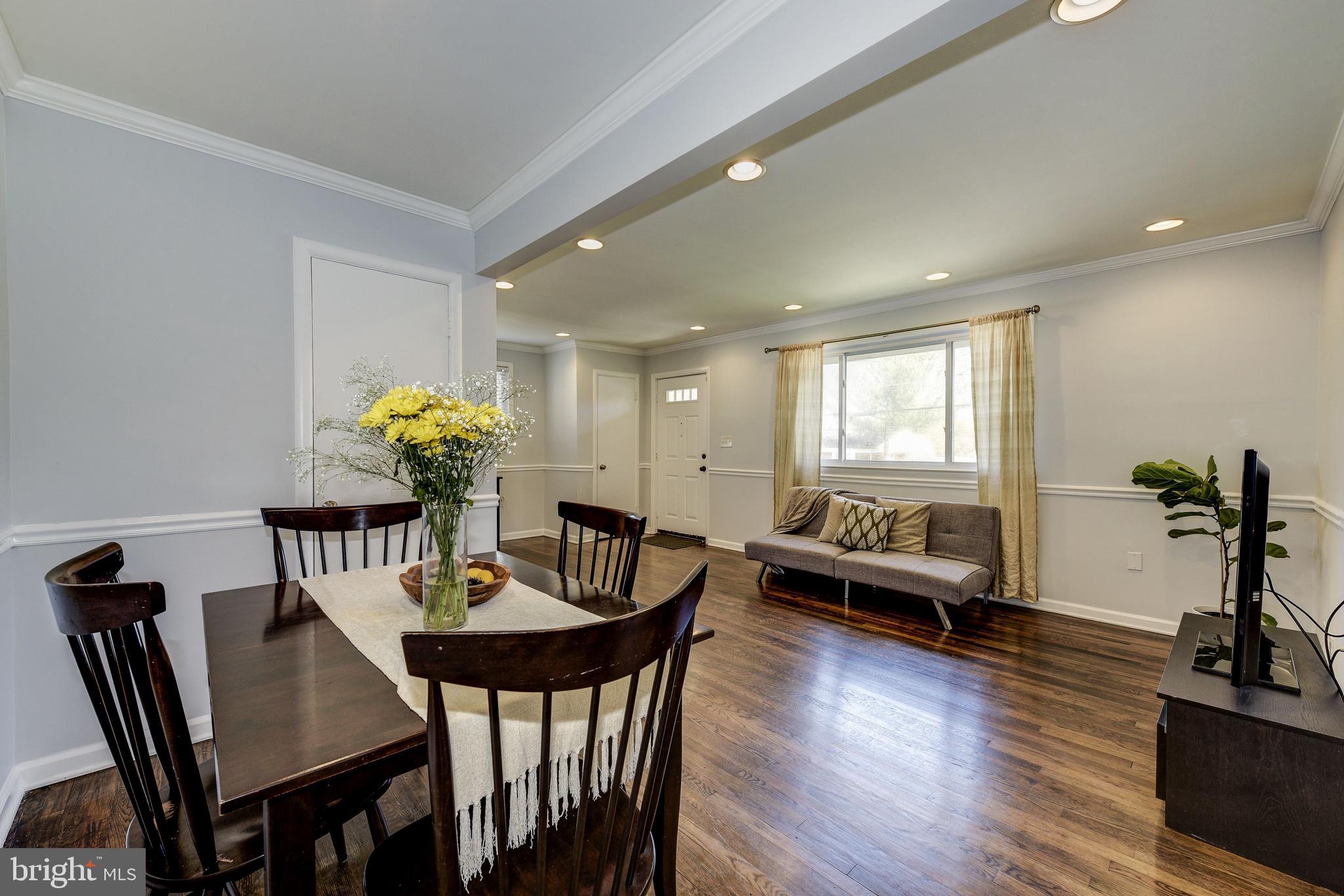 2802 Harris Avenue Silver Spring, MD 20902 - Photo 11 of 43 a view of a dining room with furniture and wooden floor