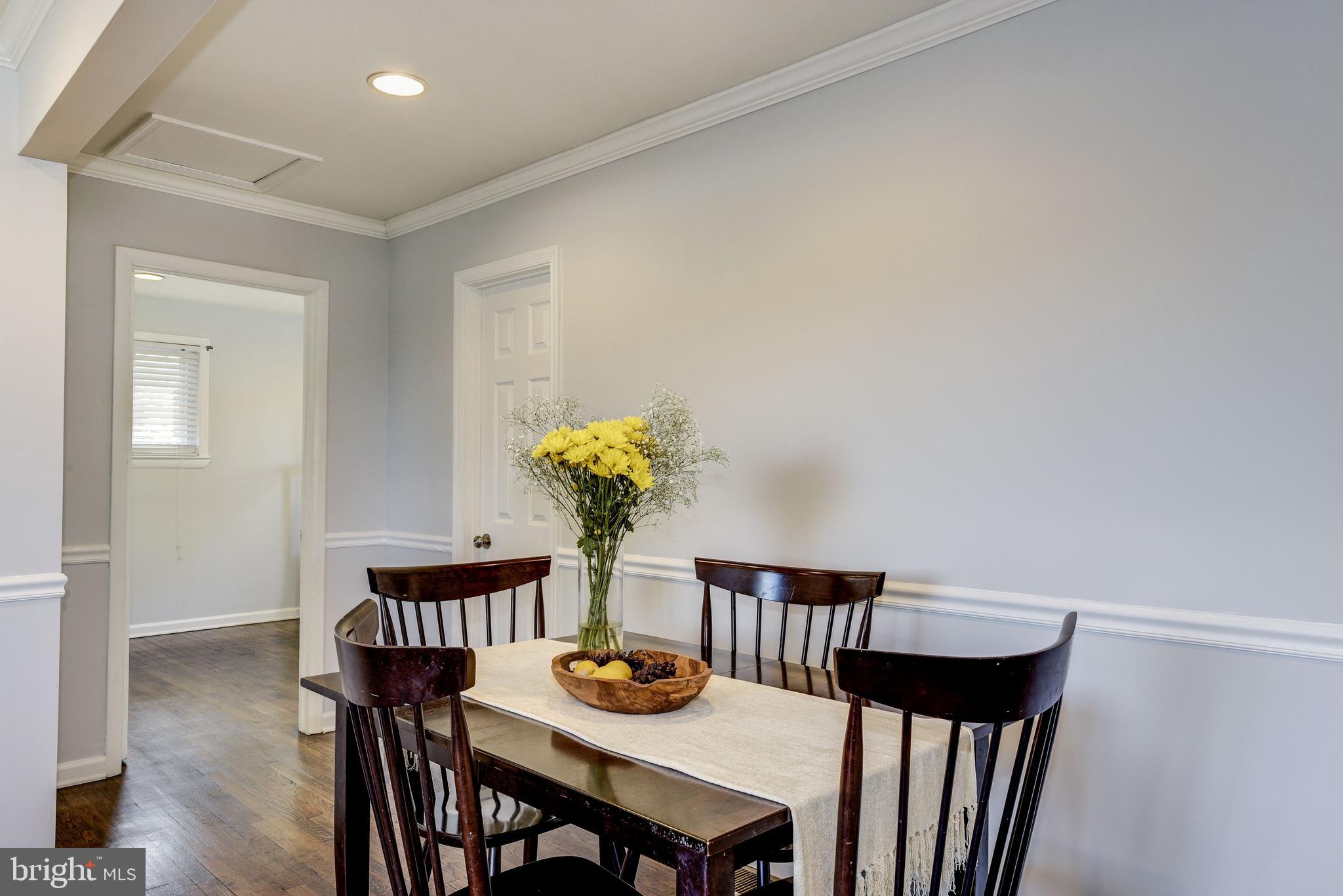 2802 Harris Avenue Silver Spring, MD 20902 - Photo 12 of 43 a view of a dining room with furniture and wooden floor