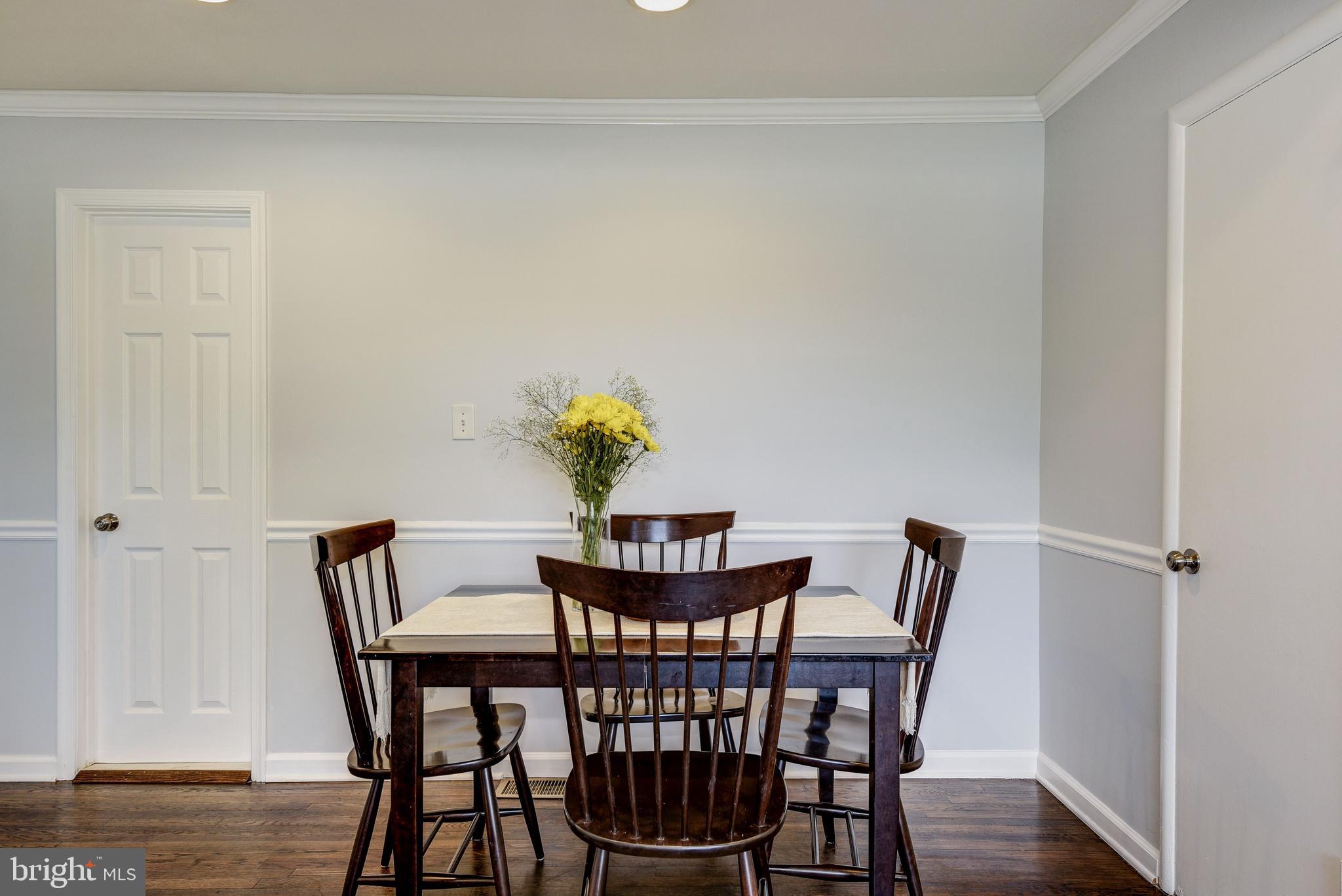 2802 Harris Avenue Silver Spring, MD 20902 - Photo 13 of 43 a view of a dining room with furniture and wooden floor