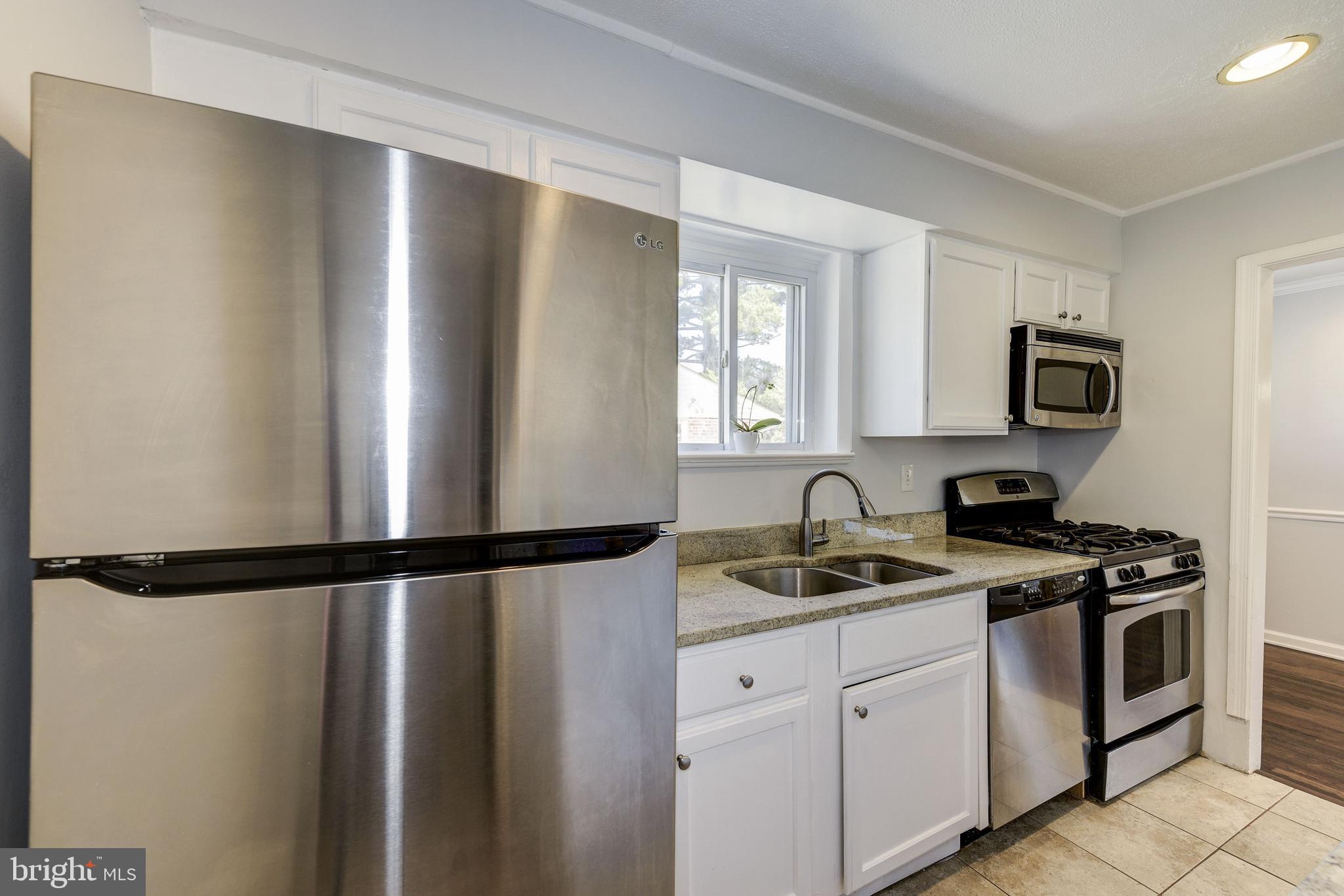 2802 Harris Avenue Silver Spring, MD 20902 - Photo 17 of 43 a kitchen with a refrigerator and a sink
