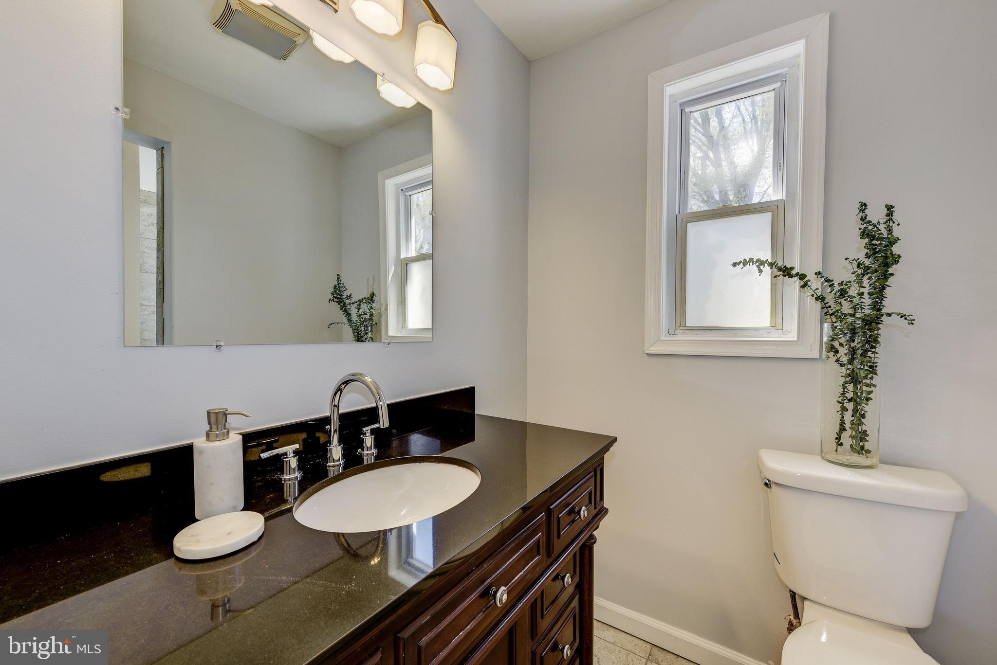 2802 Harris Avenue Silver Spring, MD 20902 - Photo 20 of 43 a bathroom with a sink a toilet and mirror