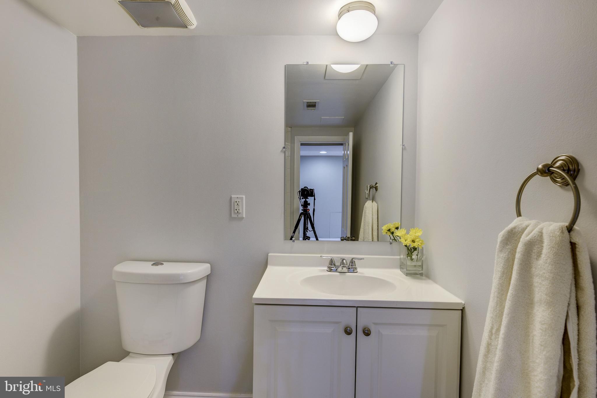 2802 Harris Avenue Silver Spring, MD 20902 - Photo 27 of 43 a bathroom with a sink vanity mirror and toilet
