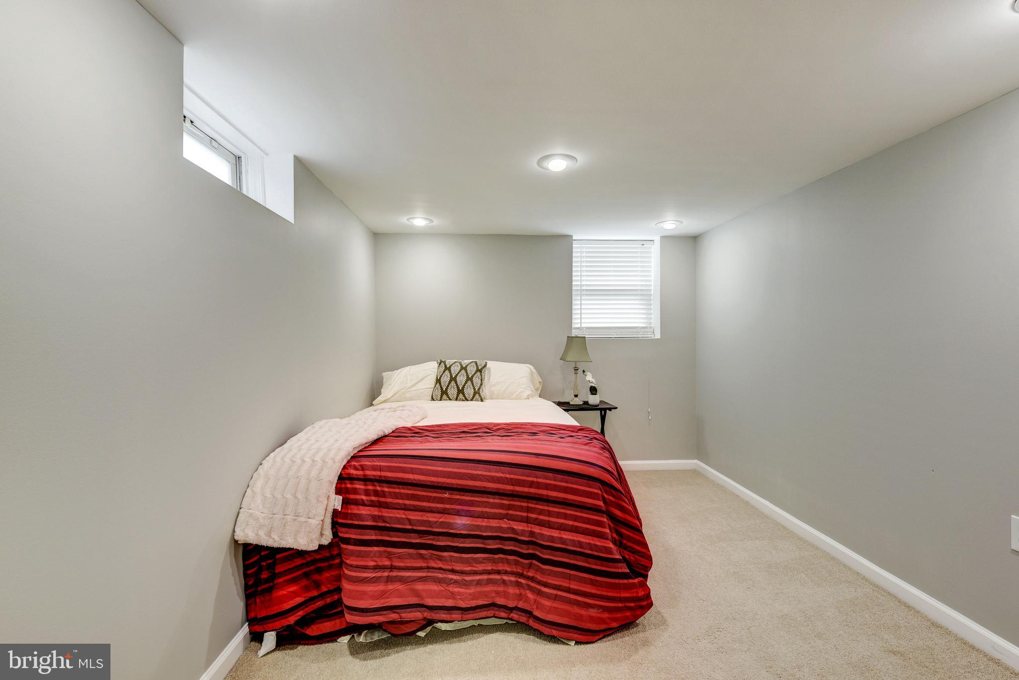 2802 Harris Avenue Silver Spring, MD 20902 - Photo 29 of 43 a bedroom with a bed and a painting on the wall