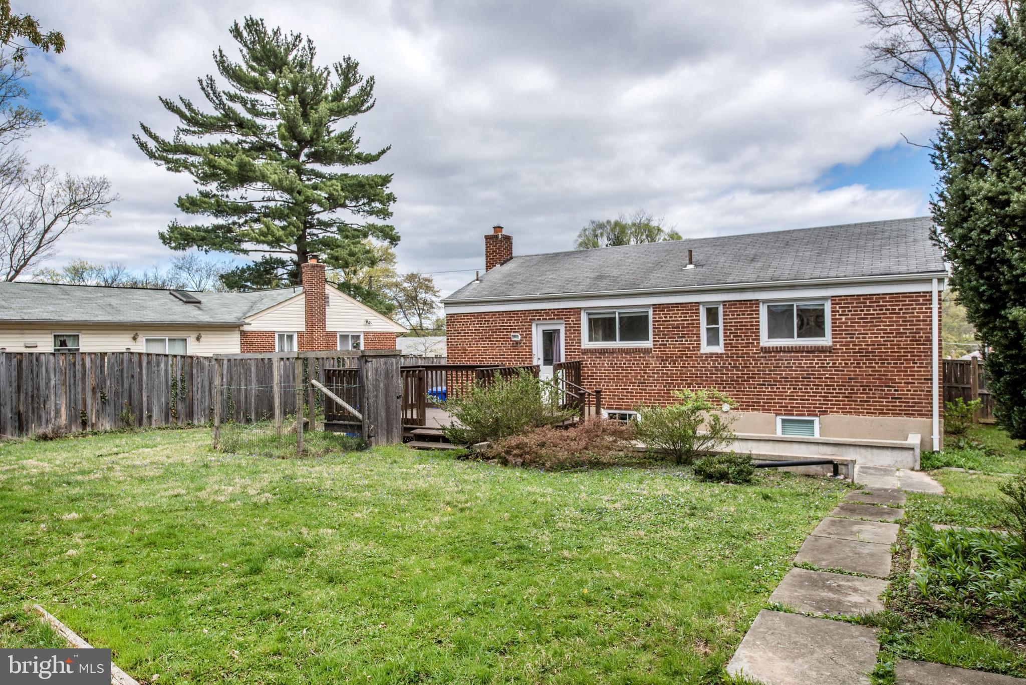 2802 Harris Avenue Silver Spring, MD 20902 - Photo 37 of 43 a view of house with a big yard and potted plants and large trees