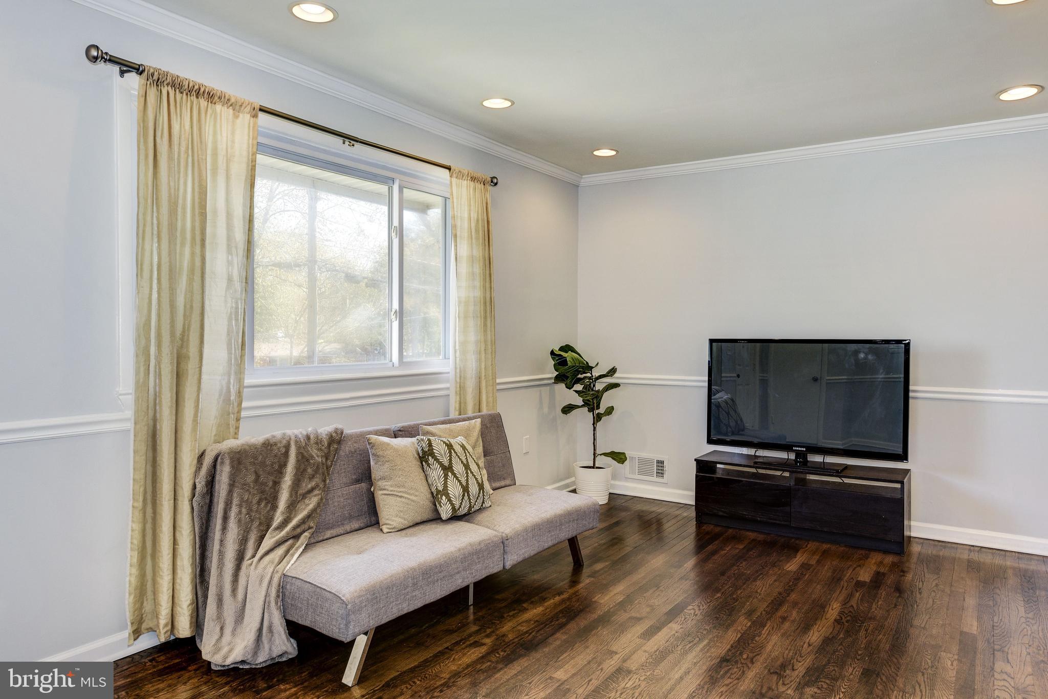 2802 Harris Avenue Silver Spring, MD 20902 - Photo 7 of 43 a living room with furniture and a flat screen tv
