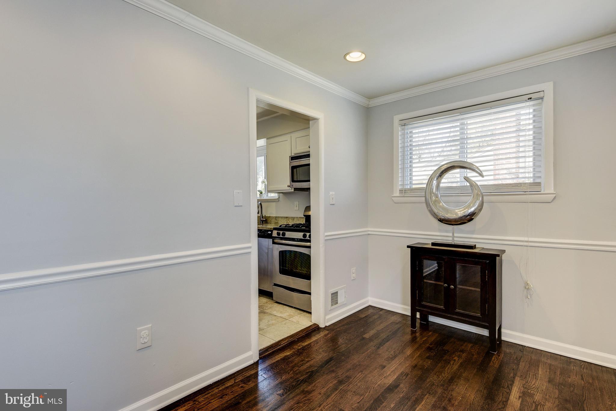 2802 Harris Avenue Silver Spring, MD 20902 - Photo 9 of 43 a living room with wooden floor and a window