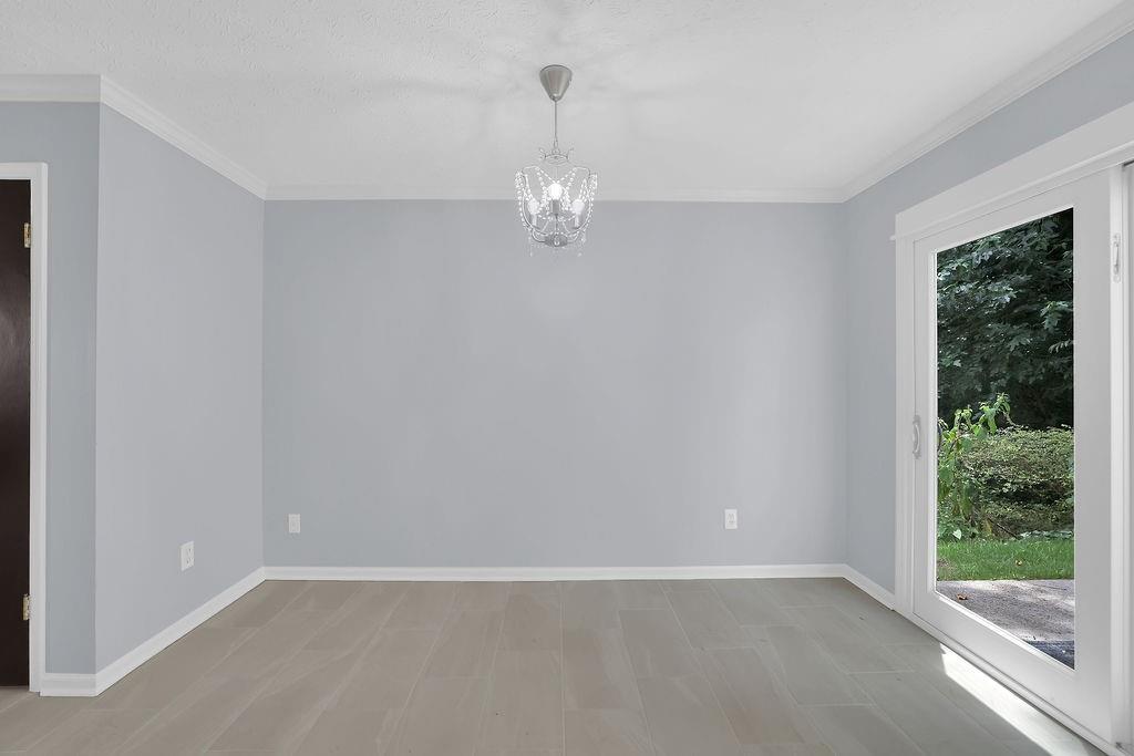 1424 Springleaf Circle Southeast Smyrna, GA 30080 - Photo 10 of 38 a view of an empty room with glass door and window