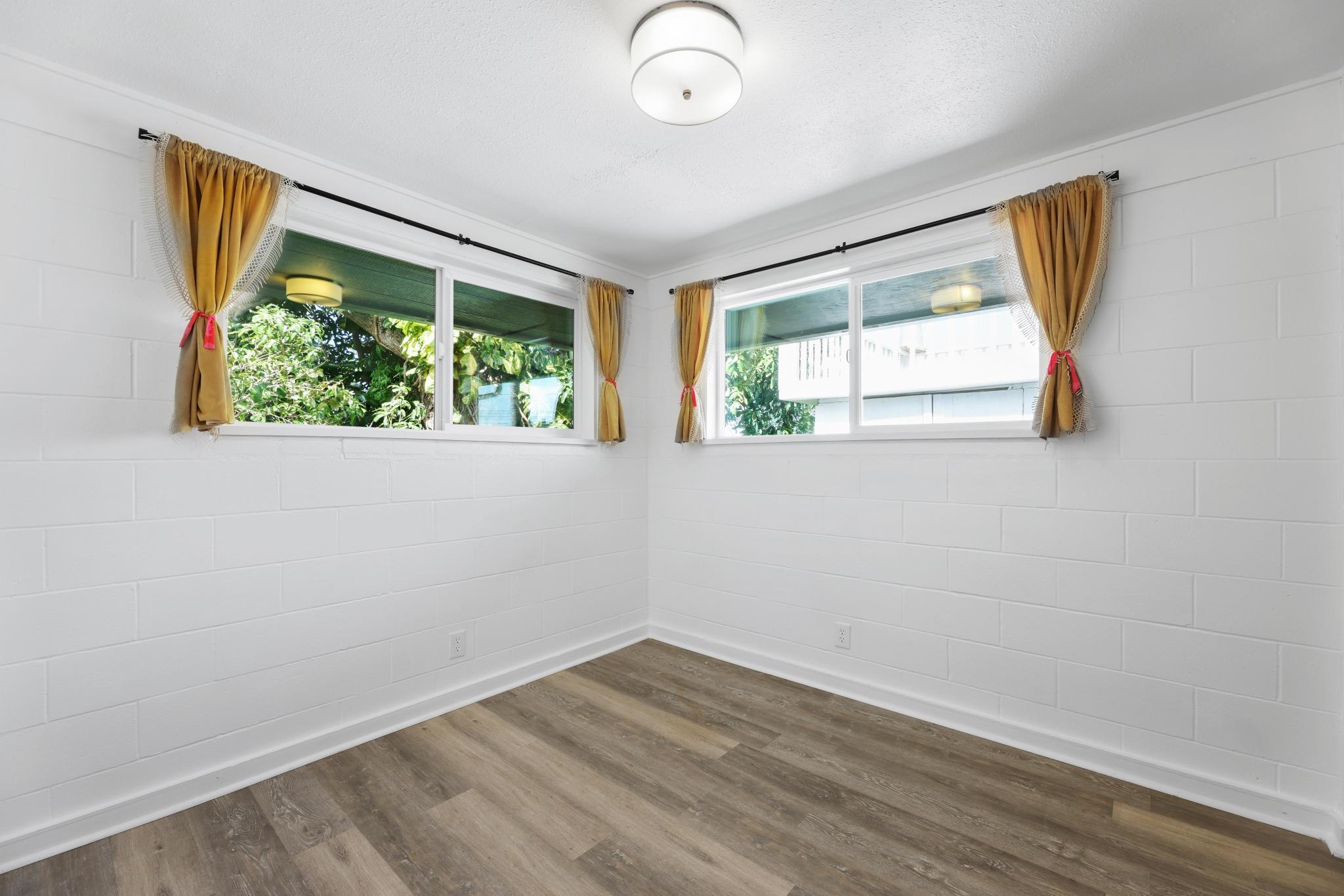 6 Kahope Place Haiku, HI 96708 - Photo 17 of 49 a view of empty room with wooden floor and fan
