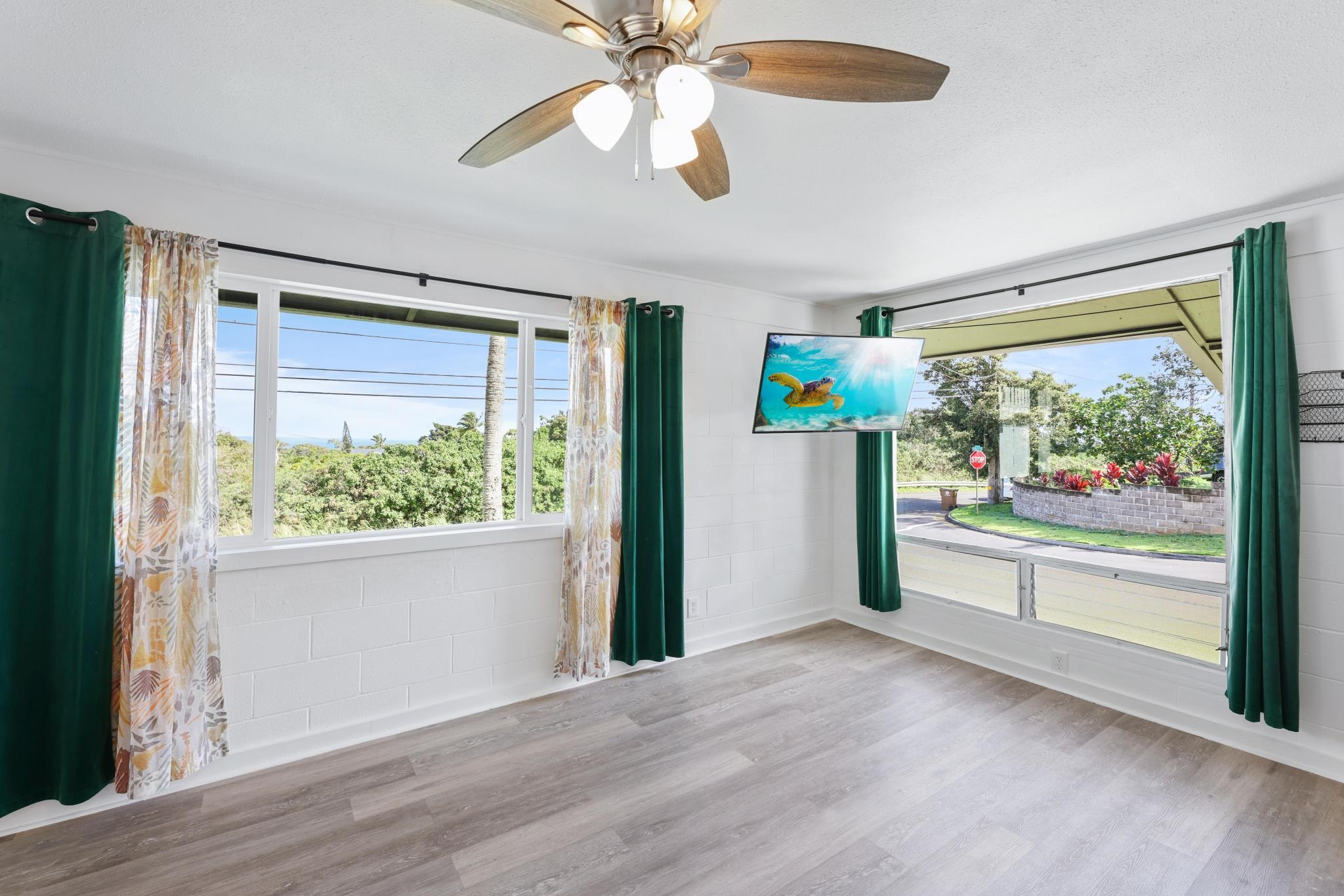 6 Kahope Place Haiku, HI 96708 - Photo 9 of 49 a view of a big room with wooden floor fridge and windows