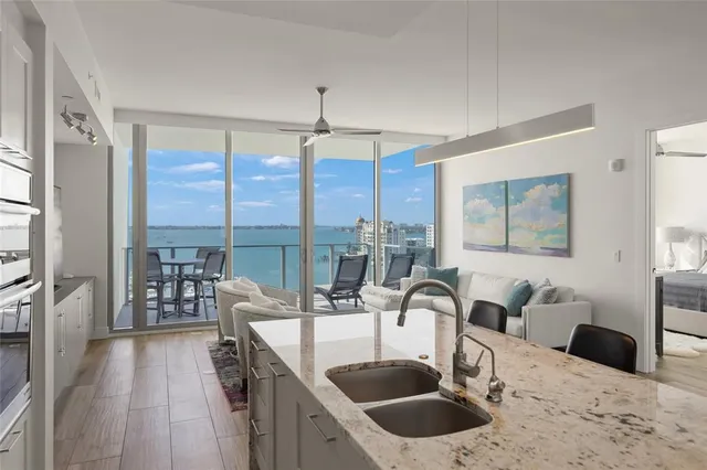 a view of a balcony with chair and wooden floor