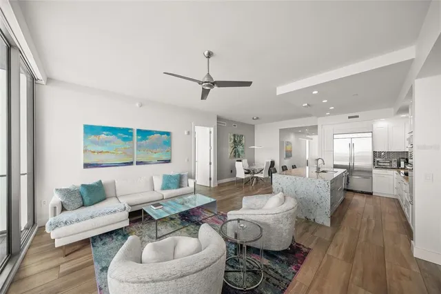 a bedroom with a bed a large window and walk in closet