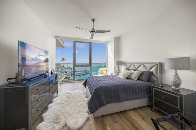 a living room with furniture and a floor to ceiling window