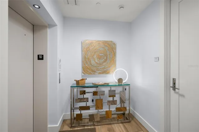 a large kitchen with a center island and stainless steel appliances