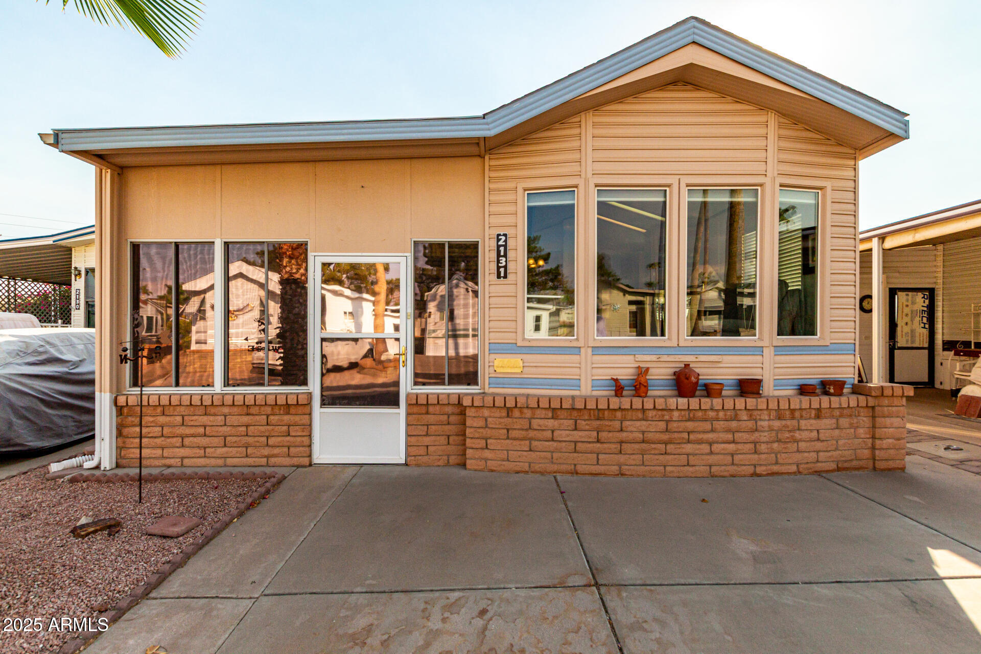 2920 South Cree Drive Apache Junction, AZ 85119 - Photo 1 of 55 a front view of a house with large windows