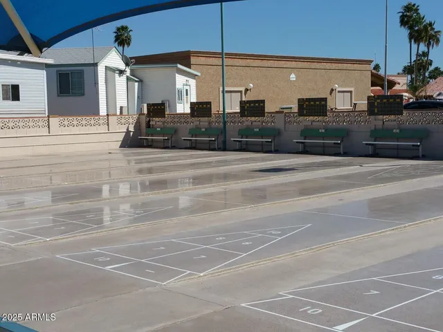 a view of a building with car parked