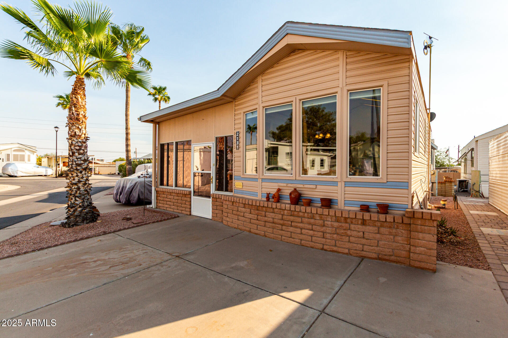 2920 South Cree Drive Apache Junction, AZ 85119 - Photo 21 of 55 a front view of a house with a porch