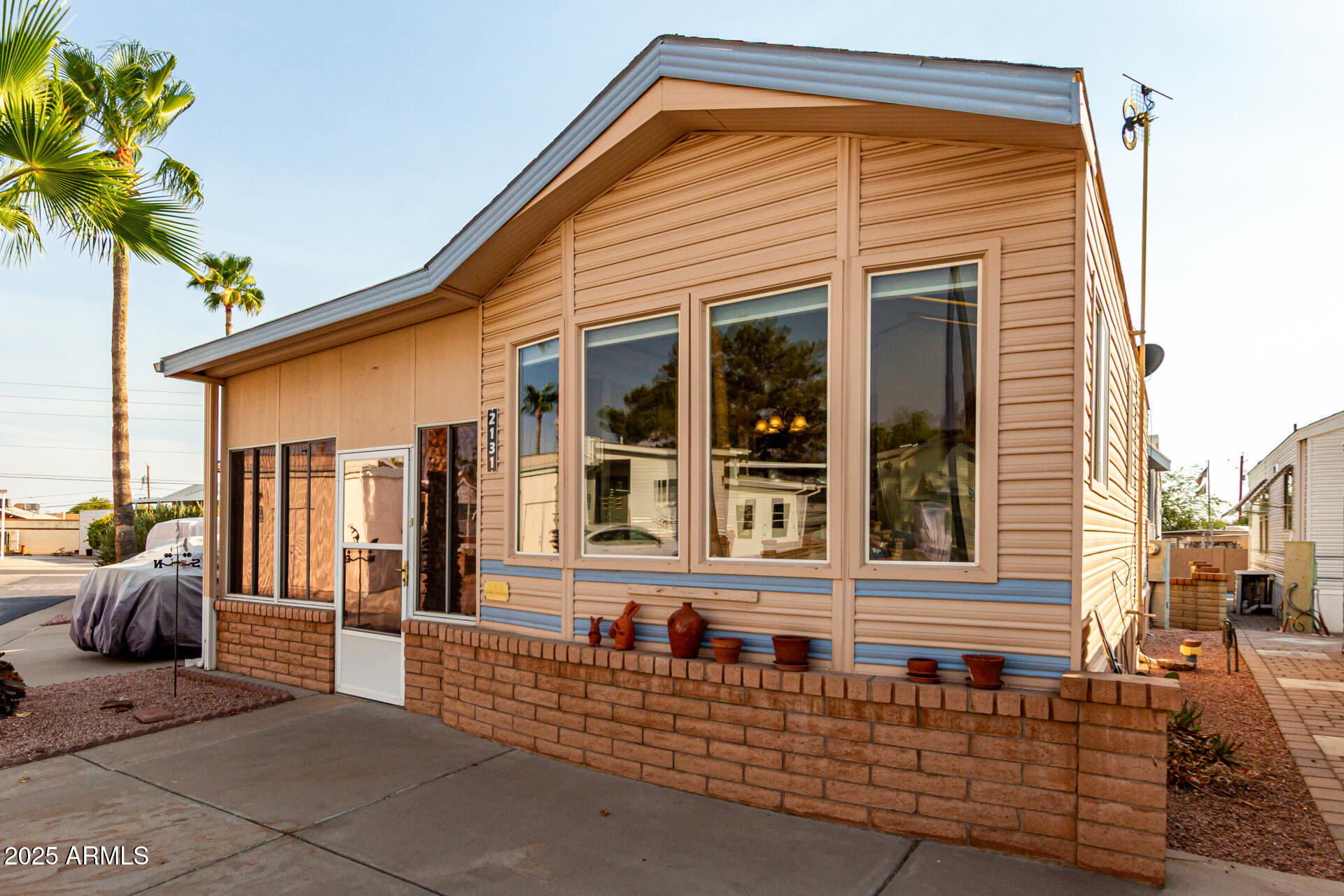 2920 South Cree Drive Apache Junction, AZ 85119 - Photo 22 of 55 a front view of a house with a porch