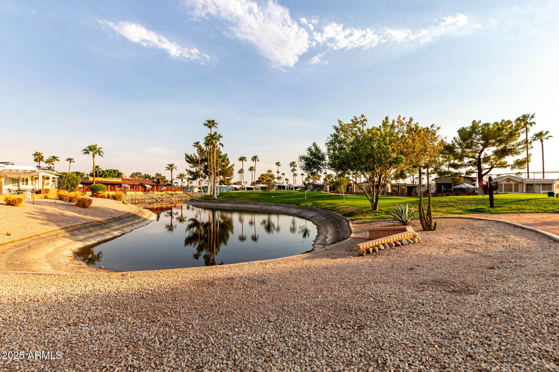 2920 South Cree Drive Apache Junction, AZ 85119 - Photo 46 of 55 a view of a swimming pool with an outdoor seating and a yard