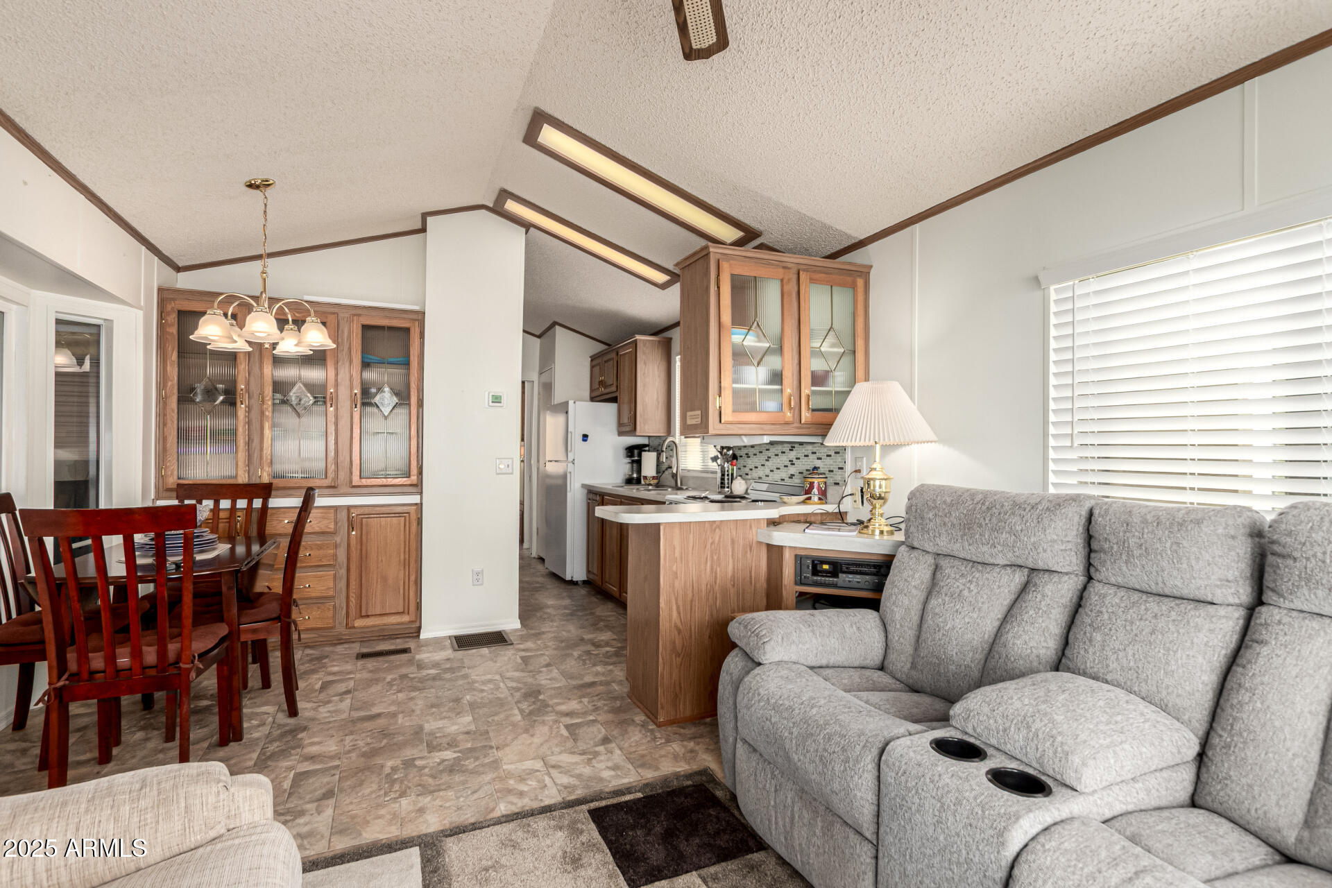 2920 South Cree Drive Apache Junction, AZ 85119 - Photo 5 of 55 a living room with furniture a dining table and a large window