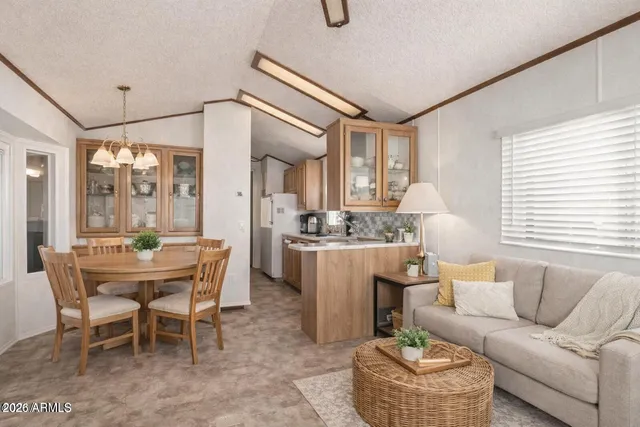 a dining room with furniture and window