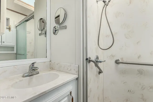 a bathroom with a sink and mirror