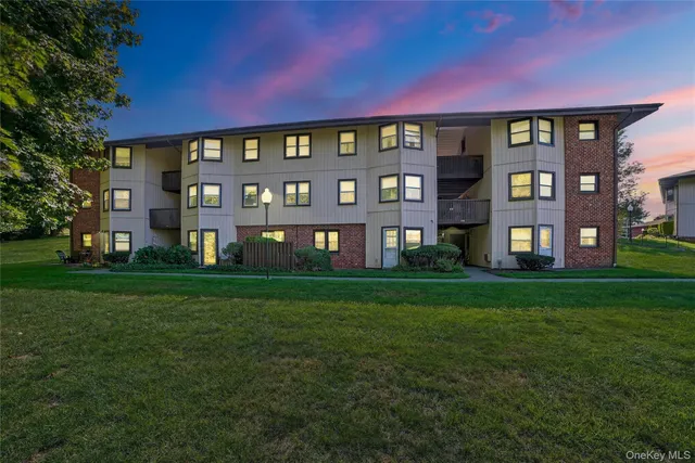 a view of a building next to a big yard