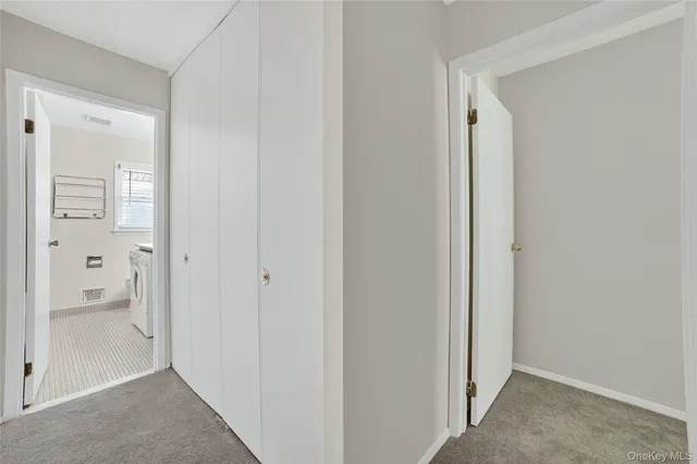 a view of a bathroom with a shower and a sink