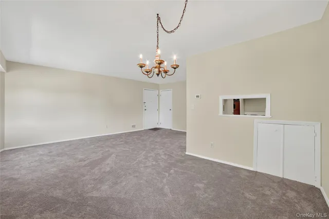 a view of a chandelier fan in a room