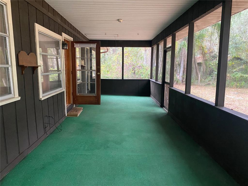 8093 Breezy Point Road East Keystone Heights, FL 32656 - Photo 7 of 34 a view of an empty room with a window
