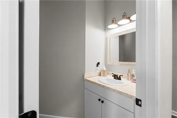 a bathroom with a toilet and a shower curtain