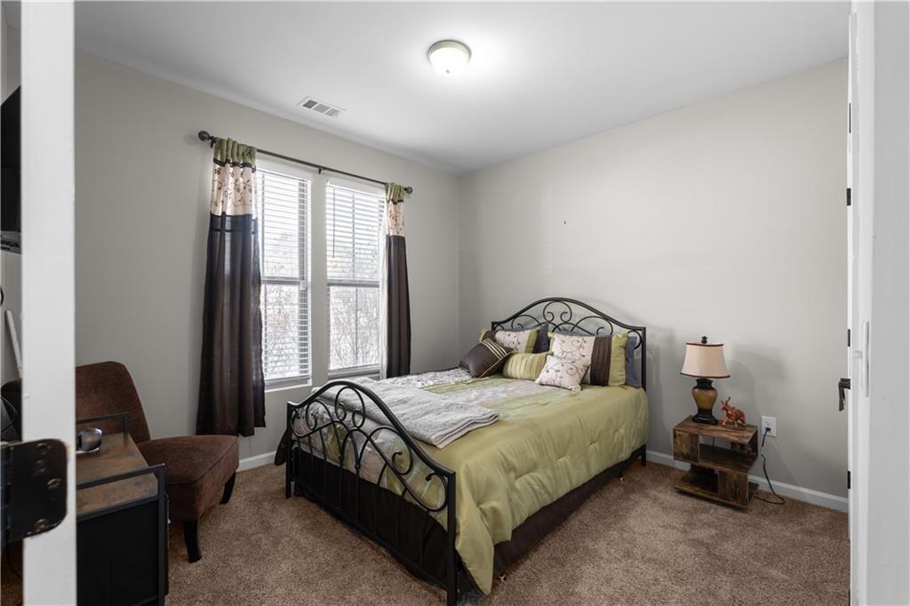 2117 Treehaven Court Decatur, GA 30035 - Photo 15 of 23 a bedroom with a bed and a window