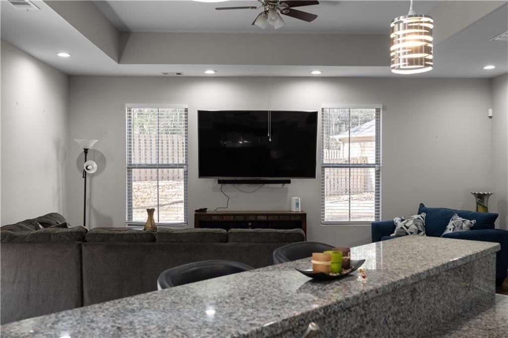 2117 Treehaven Court Decatur, GA 30035 - Photo 3 of 23 a living room with furniture a flat screen tv and window