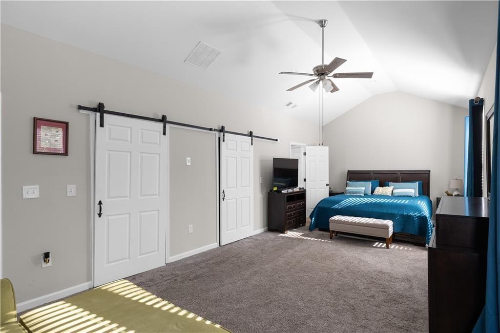 2117 Treehaven Court Decatur, GA 30035 - Photo 10 of 23 a bedroom with a bed and a ceiling fan