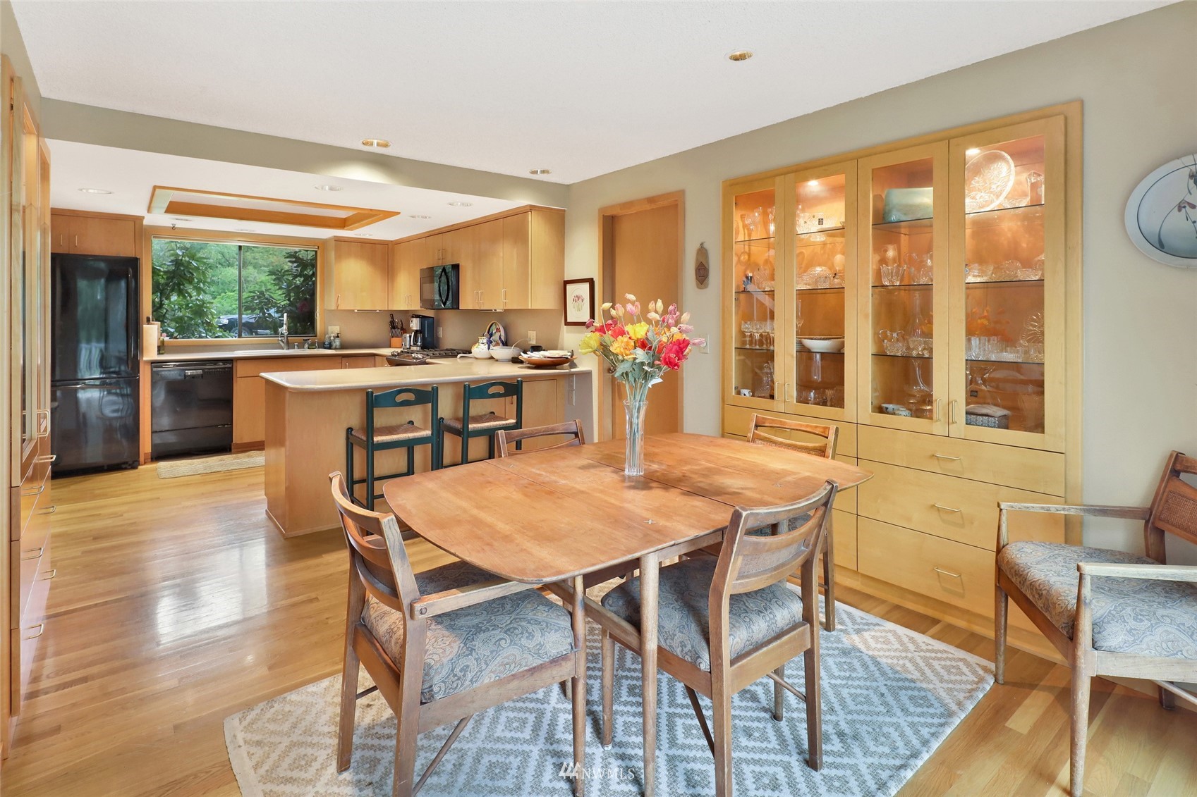 201 Middlefield Road Bellingham, WA 98225 - Photo 15 of 36 a view of a dining room with furniture window and wooden floor