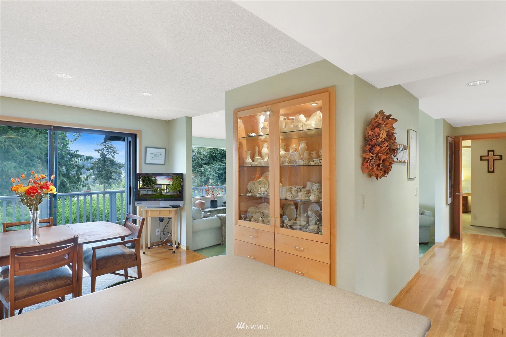 201 Middlefield Road Bellingham, WA 98225 - Photo 17 of 36 a living room with furniture a flat screen tv and a floor to ceiling window