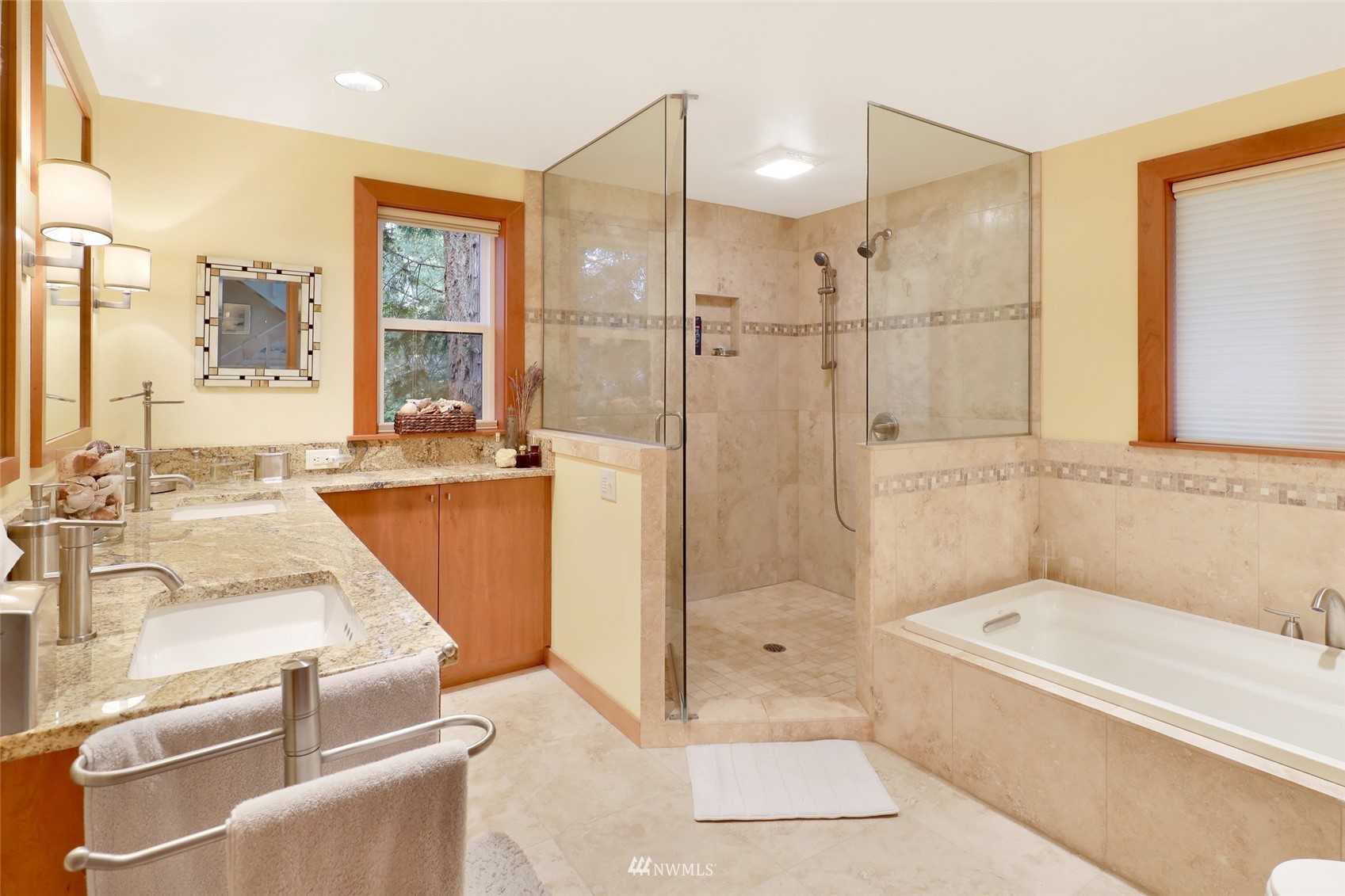 201 Middlefield Road Bellingham, WA 98225 - Photo 19 of 36 a bathroom with a granite countertop tub sink a shower and mirror
