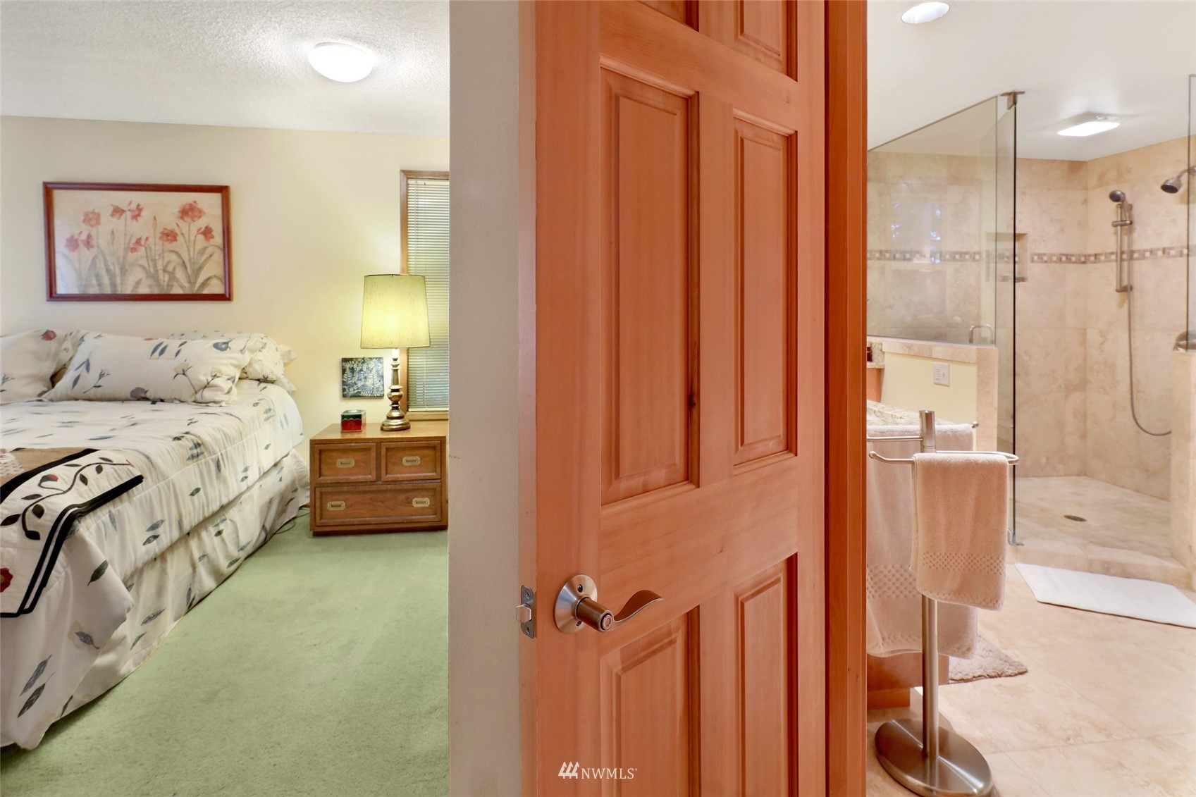 201 Middlefield Road Bellingham, WA 98225 - Photo 22 of 36 a bedroom with a bed a couch and a window