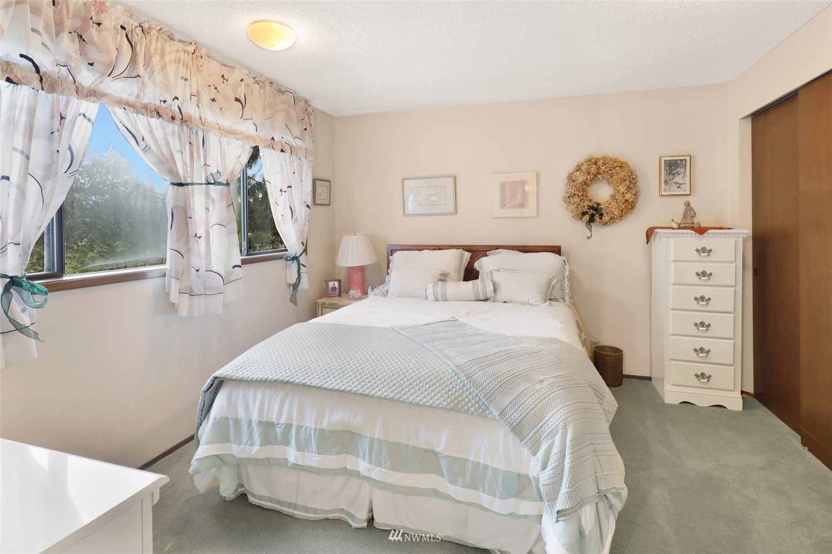 201 Middlefield Road Bellingham, WA 98225 - Photo 28 of 36 a bedroom with a bed and a window
